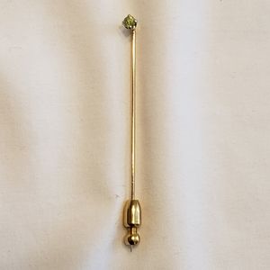 Peridot colored stone stick pin.